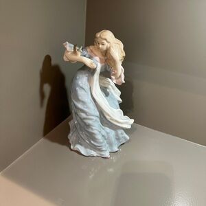 Elegant Figurine with Flowing Dress